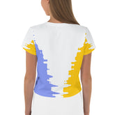 Model wearing Whispering Wind Women's Crop Tee outdoors.